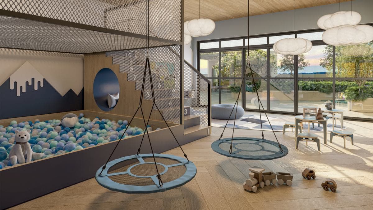 Brinquedoteca com piscina de bolinhas, balanços de disco, rede suspensa e mesinhas junto ao vidro