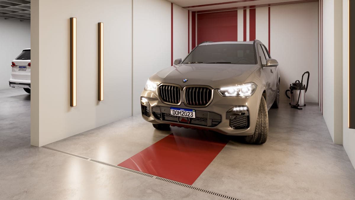 Car point na garagem, com vaga demarcada, aspirador e tomadas de apoio