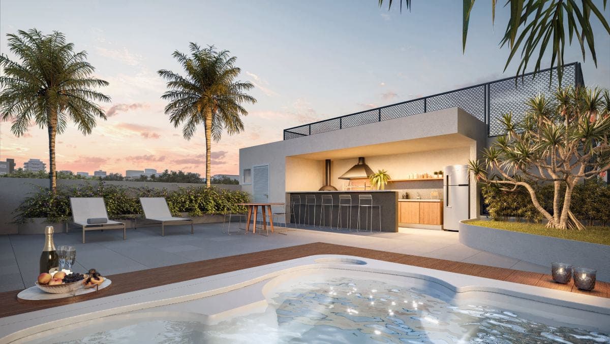 Terraço ao entardecer com ofurô, espreguiçadeiras e área gourmet coberta